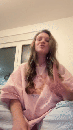 Woman records video message from bedroom in Belgrade suburb