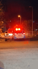 Ambulance spotted on illuminated Banda Aceh street at night