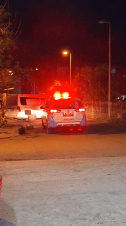 Ambulance spotted on illuminated Banda Aceh street at night