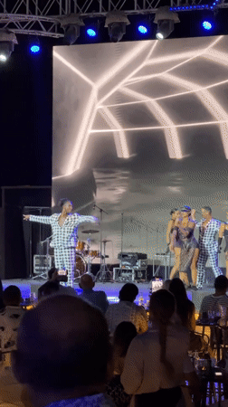 Live stage performance with dancers in checkered outfits, Egypt