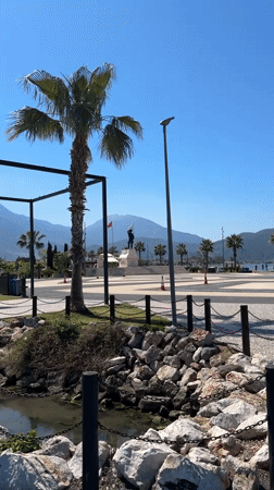 Morning scenes captured in Fethiye town square with statue