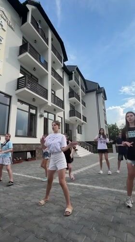 Dance rehearsals and performances outside a Solotvyno hotel