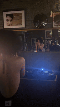 Behind the decks at a Milan bar, late evening