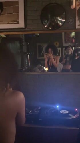 Behind the decks at a Milan bar, late evening