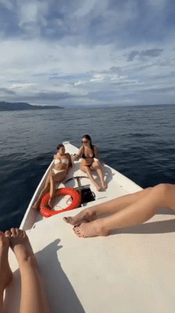 Women enjoy boat trip off Indonesian coast