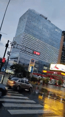 Evening rainstorm creates reflective streets in downtown Caracas
