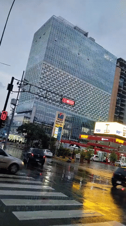 Evening rainstorm creates reflective streets in downtown Caracas