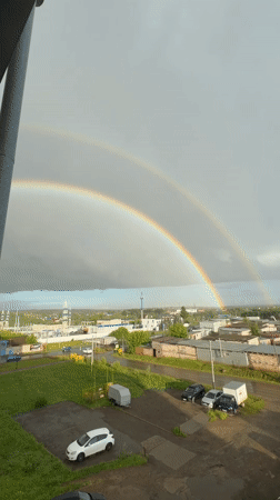 Double rainbow breaks over storm clouds in Zav'yalovo
