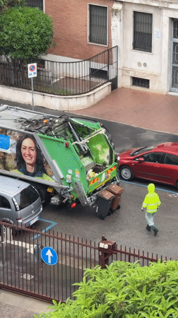Garbage truck conducts morning collection operations in Milan