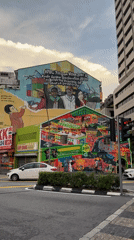 Tourists document Kuala Lumpur's street art and cultural attractions
