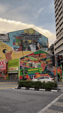 Tourists document Kuala Lumpur's street art and cultural attractions