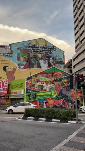 Tourists document Kuala Lumpur's street art and cultural attractions