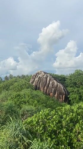 Group poses for photos on Balapitiya beach rocks