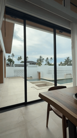 Indoor view captures swimming pool area in Baan Tai