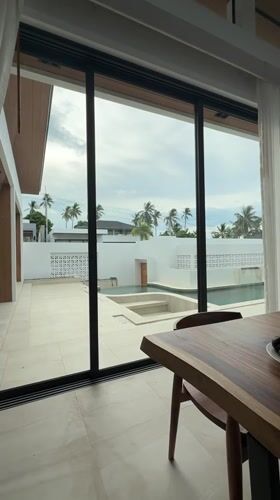 Indoor view captures swimming pool area in Baan Tai