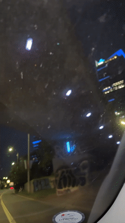 Driver records nighttime road view through dirty windshield in Sofia