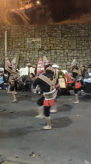 Traditional folk dancers fill a La Paz street at night