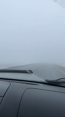 Driver encounters heavy fog on wet Russian road