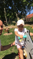 Father and daughter enjoy morning playground visit in Wisła