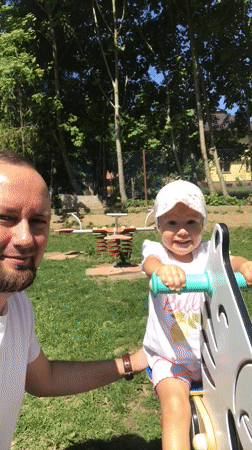 Father and daughter enjoy morning playground visit in Wisła