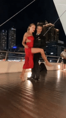 Tango dancers perform under full moon in Buenos Aires waterfront