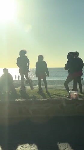 Cape Town beach cafe scene with girls, BMWs captured