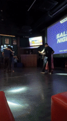 Couples enjoy salsa dancing at Colombo sports bar event