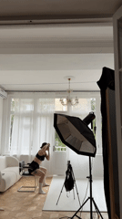 Creative shoot in a styled Tbilisi apartment with art and pink velvet
