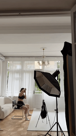Creative shoot in a styled Tbilisi apartment with art and pink velvet