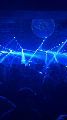 DJ performs to dancing crowd at Buenos Aires concert