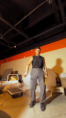 Nunchaku practice in a bare-bones Qarağandı indoor space