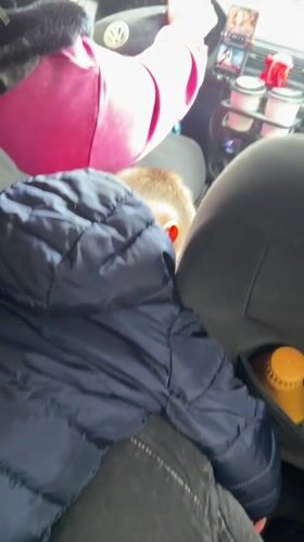 Woman in pink drives through Madan, Bulgaria