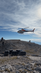 Helicopter activity over a mountain ridge in the Slovenian Alps