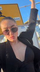 Woman films outdoor selfies in Bar, Montenegro Friday afternoon