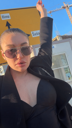 Woman films outdoor selfies in Bar, Montenegro Friday afternoon