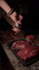Evening steak preparation captured at Gainesville outdoor kitchen