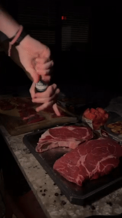 Evening steak preparation captured at Gainesville outdoor kitchen