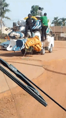 Overloaded truck carries furniture on Nigerian road