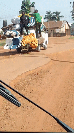 Overloaded truck carries furniture on Nigerian road