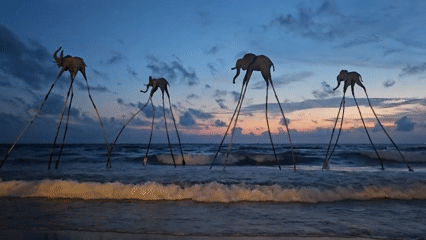Surreal beach sculptures line the Phú Quốc shore at dusk