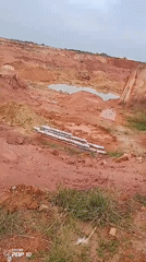 Active mining operations documented with equipment and livestock movement