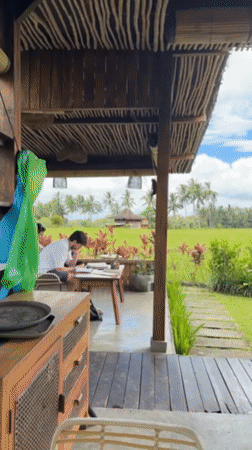 Tourist documents morning exploration of Bali rice fields