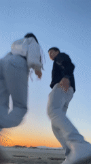 Couple shares sunset moment on Greek beach