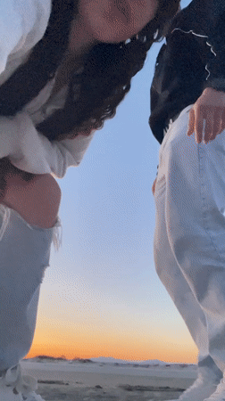 Couple shares sunset moment on Greek beach