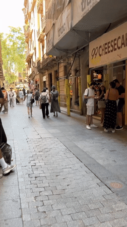 Ordinary street life documented across Barcelona neighborhoods Thursday afternoon