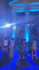 Summer night dance event outside a French town hall