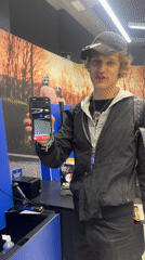 Shopper uses phone at Milan store self-checkout