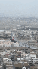 Aerial views document Quetta cityscape against mountain backdrop