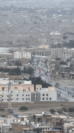 Aerial views document Quetta cityscape against mountain backdrop