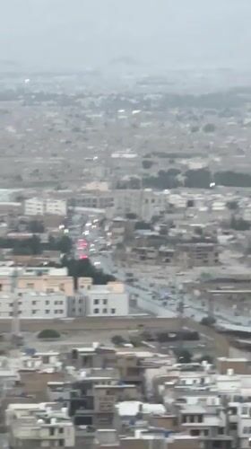 Aerial views document Quetta cityscape against mountain backdrop